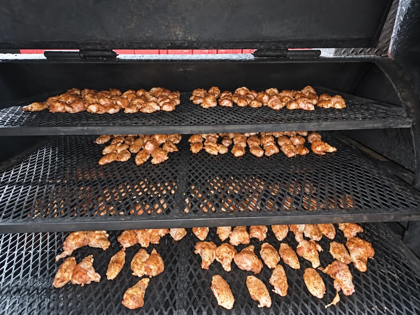 Food cooking in the Station 136 smoker